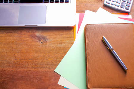 Office workplace with laptop and smart phone on wood tableの写真素材