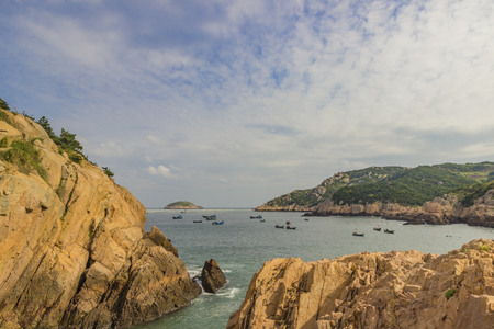Island with fishing boats sceneの写真素材