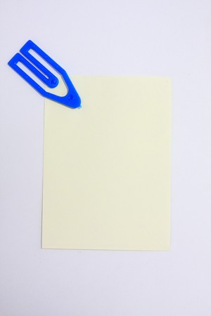 blue clip with yellow paperの写真素材