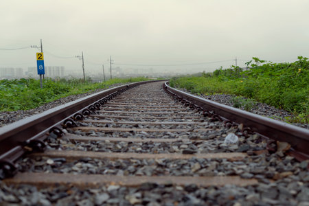 A sentimental railroad view on a rainy dayの写真素材