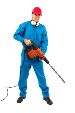 worker with protective gear holding a hammer drill on a white backgroundの写真素材