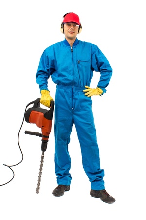 worker with protective gear holding a hammer drill on a white backgroundの写真素材