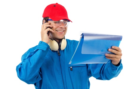 worker who looks at a project and talking on the phoneの写真素材