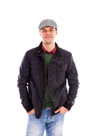 Portrait of happy handsome young man with hands in pockets,  isolated on white backgroundの写真素材