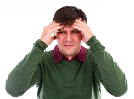 Handsome young man with headache isolated on white backgroundの写真素材