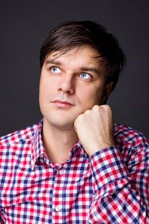 Closeup portrait of a man thinking about a problem on grey backgroundの写真素材