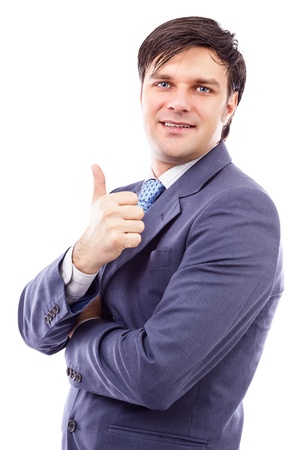 Smiling confident business man holding his thumb up isolated on white backgroundの写真素材