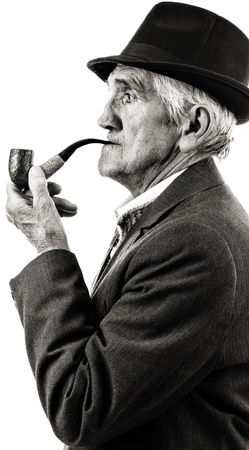 Closeup portrait of a senior smoking a pipe. Black and whiteの写真素材