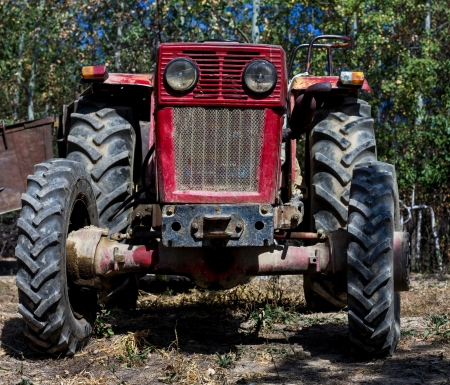 front of a farm tractor in a gardenの写真素材