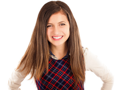 Sweet friendly young student girl isolated over white backgroundの写真素材