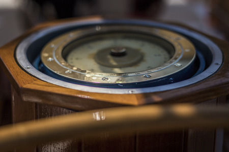 Closeup of a compass on a big ship