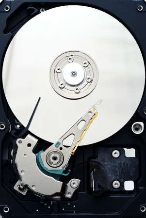Disassembled computer hard disk drive internals inside close up, view from the topの写真素材