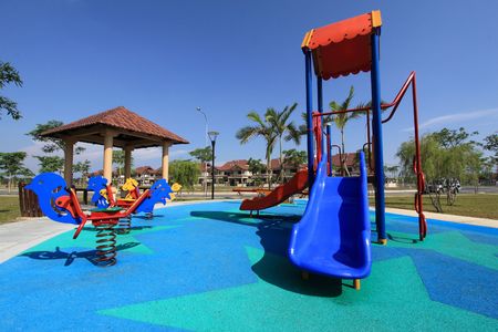     colorful    children   playground    on   park   with   blue  sky  