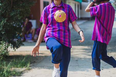 Students take exams Sepak Takraw to use knee to touch the ball in Kanchanaburi Thailand.の写真素材