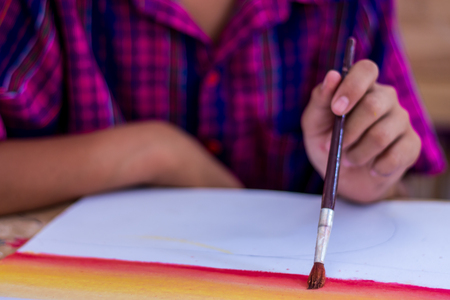 Thai students are testing the use of brushes with poster color.の写真素材