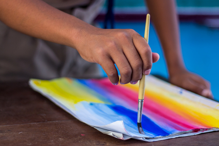 Thai students are testing the use of brushes with poster color.の写真素材