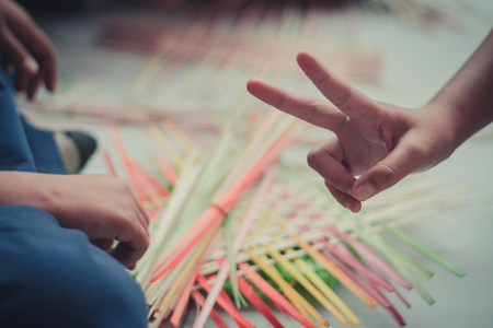 Closeup to hand of Thai students grade 4 in primary school are weaving pattern thai.の写真素材