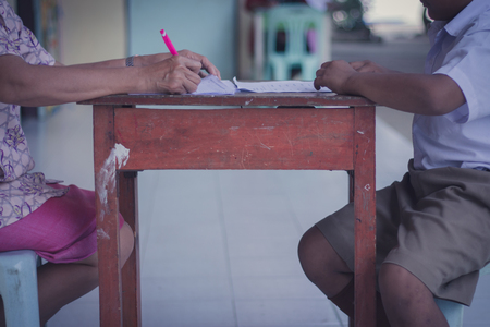 Thai Reading Examination between teacher and student grade 4 
Outside the classroom  in primary school.の写真素材
