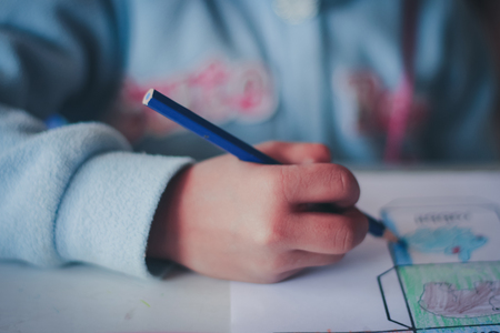 Closeup to Elementary school student are coloring.の写真素材