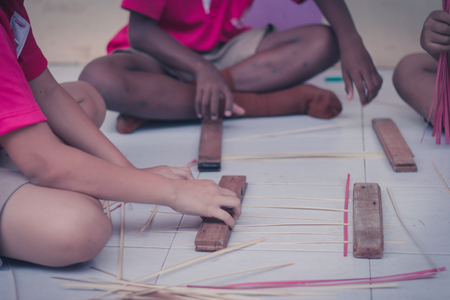 Thai students grade 4 in primary school are weaving pattern thai.の写真素材