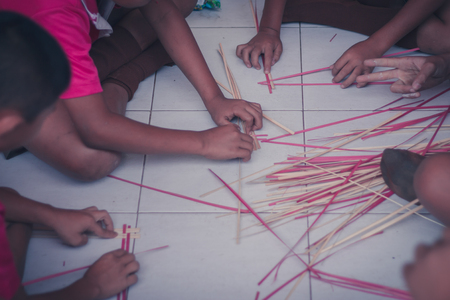 Thai students grade 4 in primary school are weaving pattern thai.