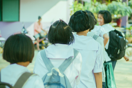 Happy students having fun on street after schoolのeditorial素材