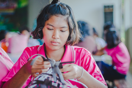 KANCHANABURI THAILAND - FEBRUARY 21 : Unidentified Local instructors teach Thai handicrafts to unidentified students on february 21,2018 at Wat Krang Thong School in Kanchanaburi, Thailandのeditorial素材