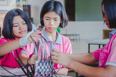KANCHANABURI THAILAND - FEBRUARY 21 : Unidentified Local instructors teach Thai handicrafts to unidentified students on february 21,2018 at Wat Krang Thong School in Kanchanaburi, Thailandのeditorial素材