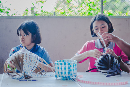 KANCHANABURI THAILAND - FEBRUARY 21 : Unidentified Local instructors teach Thai handicrafts to unidentified students on february 21,2018 at Wat Krang Thong School in Kanchanaburi, Thailandのeditorial素材