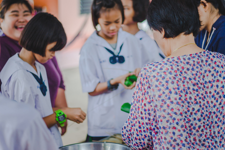 KANCHANABURI THAILAND - FEBRUARY 22 : Unidentified students
learn to make bananas with sticky rice on february 20,2018 at Wat Krang Thong School in Kanchanaburi, Thailandのeditorial素材