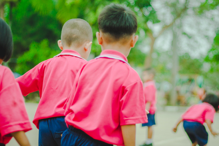Happy Kindergarten students are exercising in morning.の写真素材