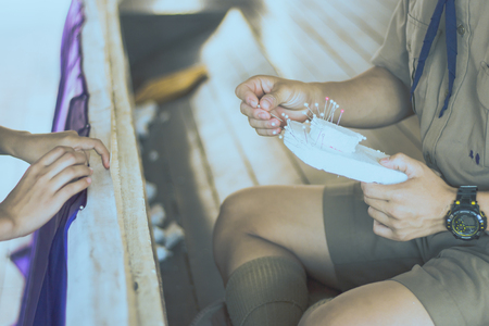 Close-up to Student hands are decorating the curtains.Decorate the stageの写真素材