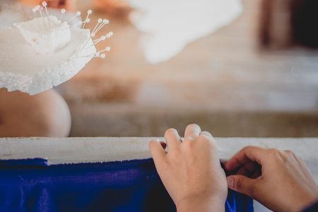 Close-up to Student hands are decorating the curtains.
Decorate the stageの写真素材