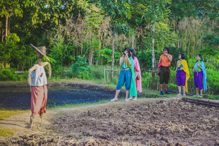 KANCHANABURI,THAILAND-DECEMBER 10 : Unidentified tourists in Thai costumes take photos of themselves  on December 10,2017 at  Mallika City (Mallika City or Muang Mallika is a historic site) in Kanchanaburi, Thailand.のeditorial素材
