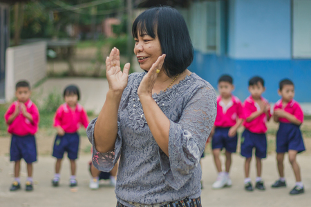 KANCHANABURI THAILAND - FEBRUARY 23 : Unidentified kids exercise in the morning before class on february 23,2018 at Wat Krang Thong School in Kanchanaburi, Thailandのeditorial素材