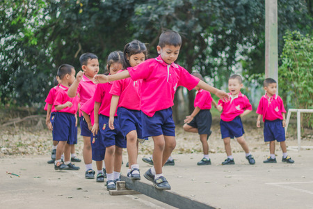 KANCHANABURI THAILAND - FEBRUARY 23 : Unidentified kids exercise in the morning before class on february 23,2018 at Wat Krang Thong School in Kanchanaburi, Thailandのeditorial素材
