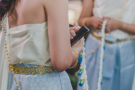 Thai Traditional Wedding Ceremony. Barring the Groom from Approaching the Bride.の写真素材