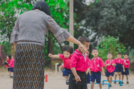 KANCHANABURI THAILAND - FEBRUARY 23 : Unidentified kids exercise in the morning before class on february 23,2018 at Wat Krang Thong School in Kanchanaburi, Thailandのeditorial素材