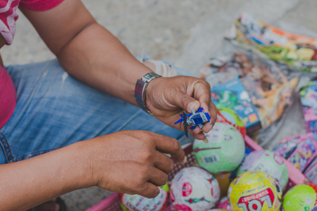 KANCHANABURI THAILAND - FEBRUARY 4 : Unidentified People select to buy a variety toys on local annual festival on february 4,2018 at Thamuang Old Market  in Kanchanaburi, Thailandのeditorial素材