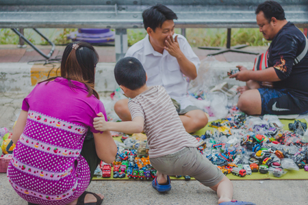 KANCHANABURI THAILAND - FEBRUARY 4 : Unidentified People select to buy a variety toys on local annual festival on february 4,2018 at Thamuang Old Market  in Kanchanaburi, Thailandのeditorial素材