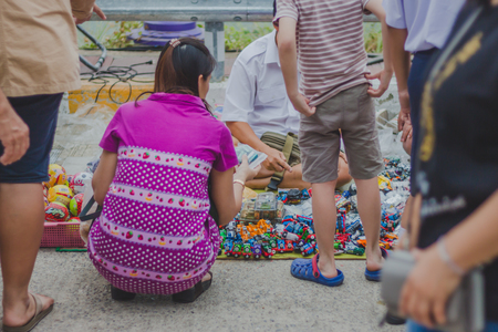 KANCHANABURI THAILAND - FEBRUARY 4 : Unidentified People select to buy a variety toys on local annual festival on february 4,2018 at Thamuang Old Market  in Kanchanaburi, Thailandのeditorial素材