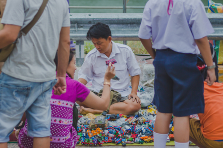 KANCHANABURI THAILAND - FEBRUARY 4 : Unidentified People select to buy a variety toys on local annual festival on february 4,2018 at Thamuang Old Market  in Kanchanaburi, Thailandのeditorial素材