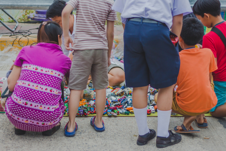 KANCHANABURI THAILAND - FEBRUARY 4 : Unidentified People select to buy a variety toys on local annual festival on february 4,2018 at Thamuang Old Market  in Kanchanaburi, Thailandのeditorial素材