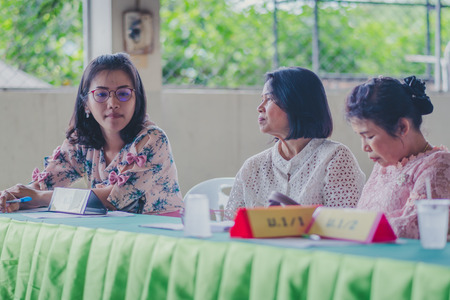 KANCHANABURI THAILAND - JUNE 1 : Unidentified teachers welcome the parents of the students at the annual Parent Meeting on June 1,2018 at Watkrangthongratburana school in Kanchanaburi, Thailandのeditorial素材