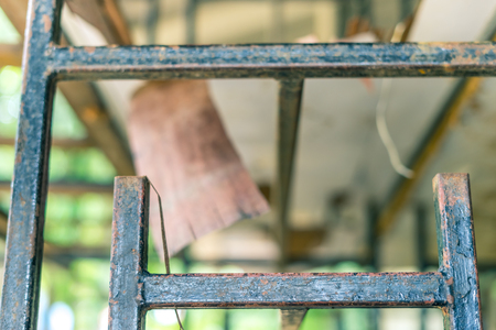 Old broken tables and chairs in school for sale.の写真素材