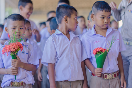 KANCHANABURI THAILAND - JUNE 14 : Unidentified students decorate pedestal tray and flower for give...