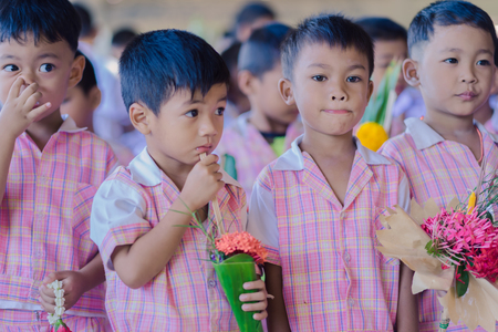KANCHANABURI THAILAND - JUNE 14 : Unidentified students decorate pedestal tray and flower for give...