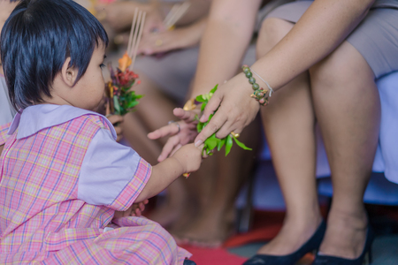 KANCHANABURI THAILAND - JUNE 14 : Unidentified students decorate pedestal tray and flower for give to teachers on Teacher Day on June 14,2018 at Watkrangthongratburana school in Kanchanaburi, Thailandのeditorial素材