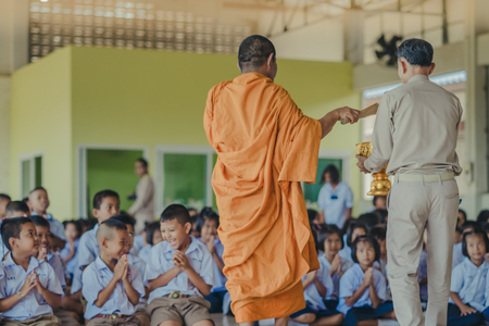 KANCHANABURI THAILAND - JUNE 14 : Unidentified teachers and students make merit to the monks on the Teacher Day on June 14,2018 at Watkrangthongratburana school in Kanchanaburi, Thailandのeditorial素材
