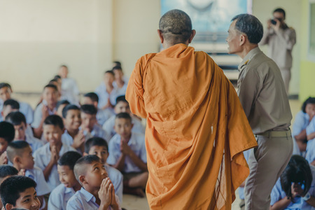 KANCHANABURI THAILAND - JUNE 14 : Unidentified teachers and students make merit to the monks on the Teacher Day on June 14,2018 at Watkrangthongratburana school in Kanchanaburi, Thailandのeditorial素材